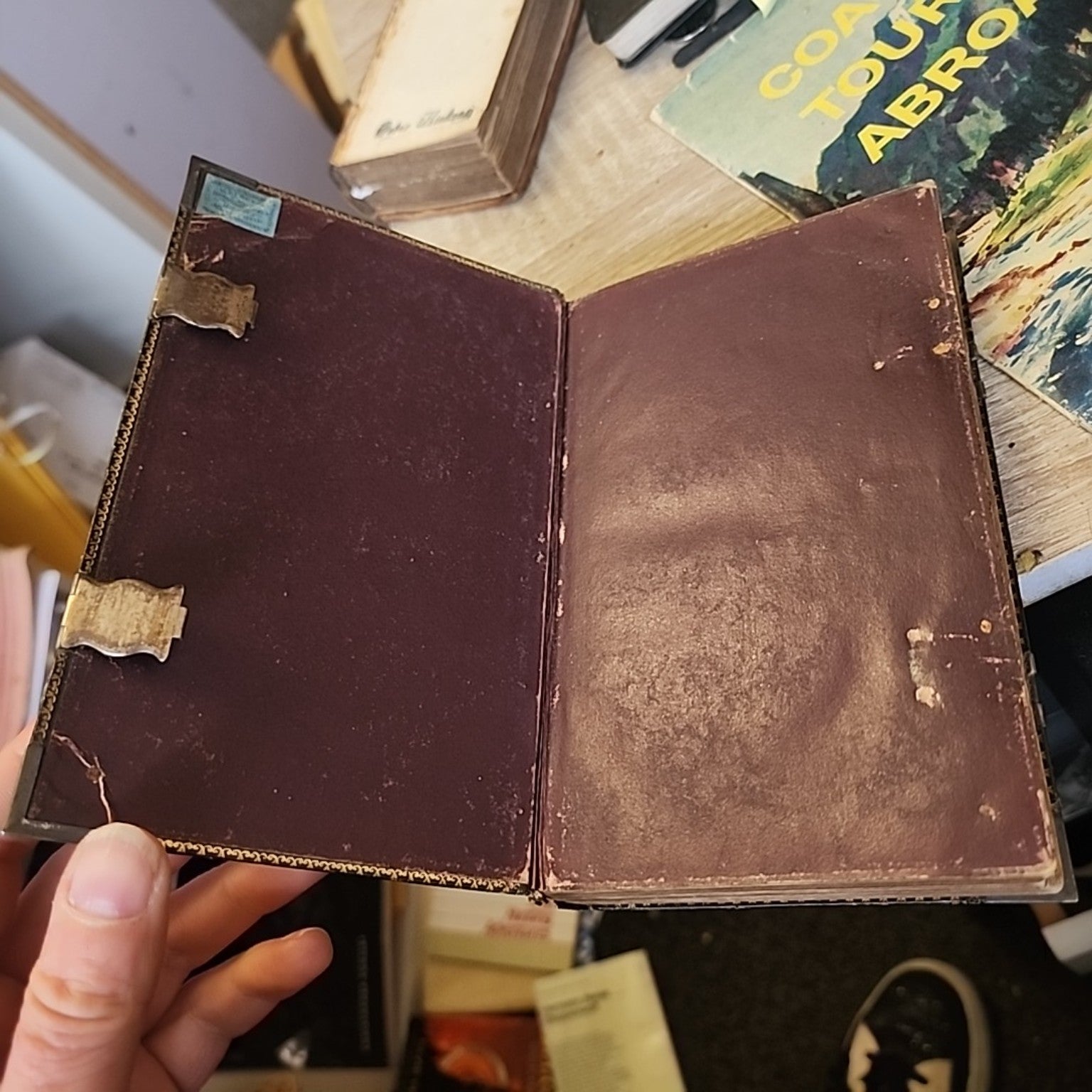 Antique English Version of the Polyglott Bible showing maroon endpapers and metal clasp fittings