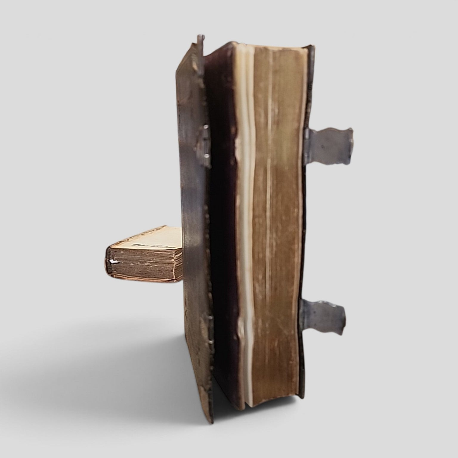 Antique English Version of the Polyglott Bible open with metal clasps visible