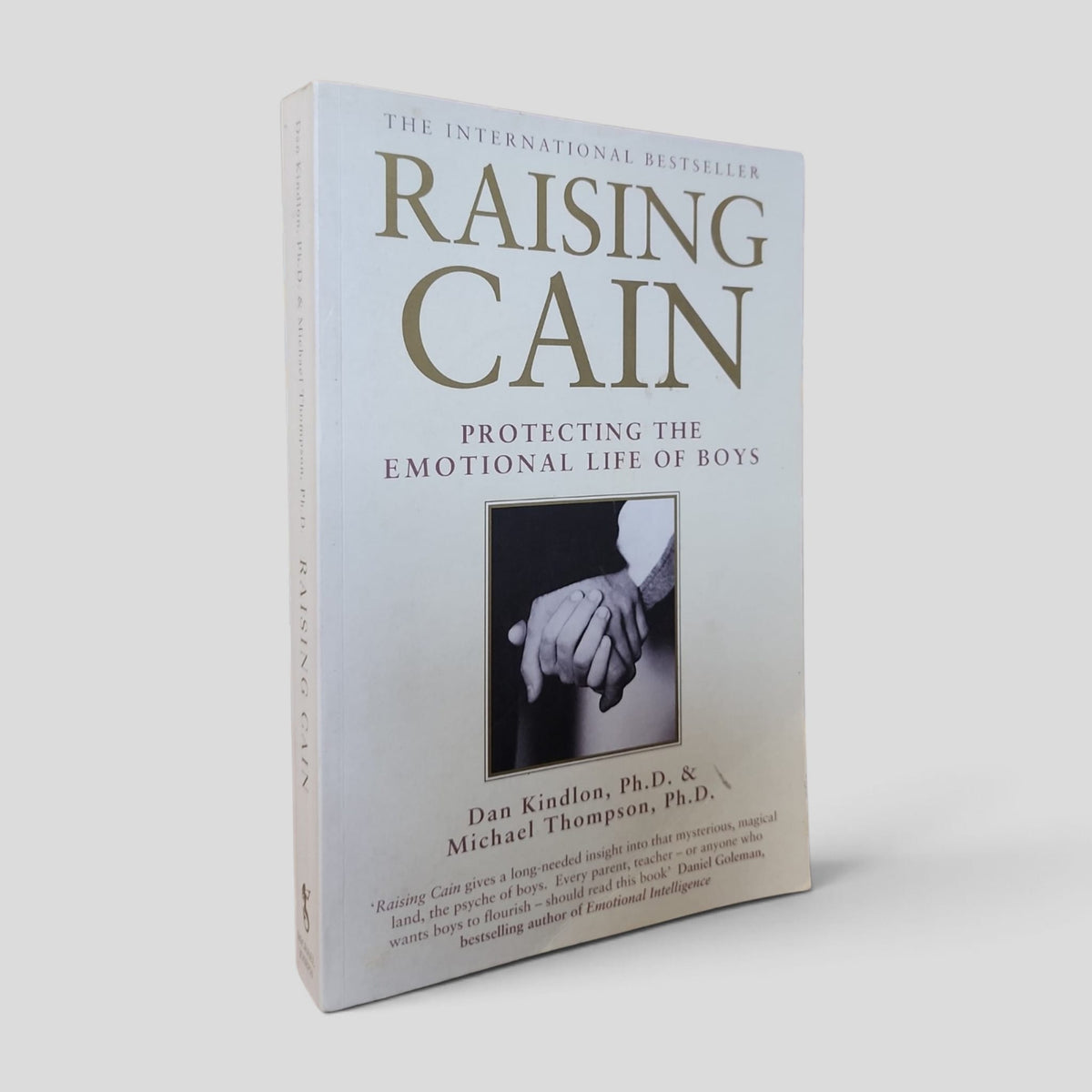 Front cover of the actual copy: Raising Cain: Protecting the Emotional Life of Boys by Dan Kindlon and Michael Thompson