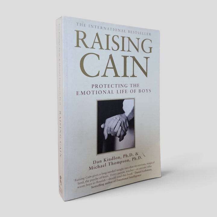 Front cover of the actual copy: Raising Cain: Protecting the Emotional Life of Boys by Dan Kindlon and Michael Thompson