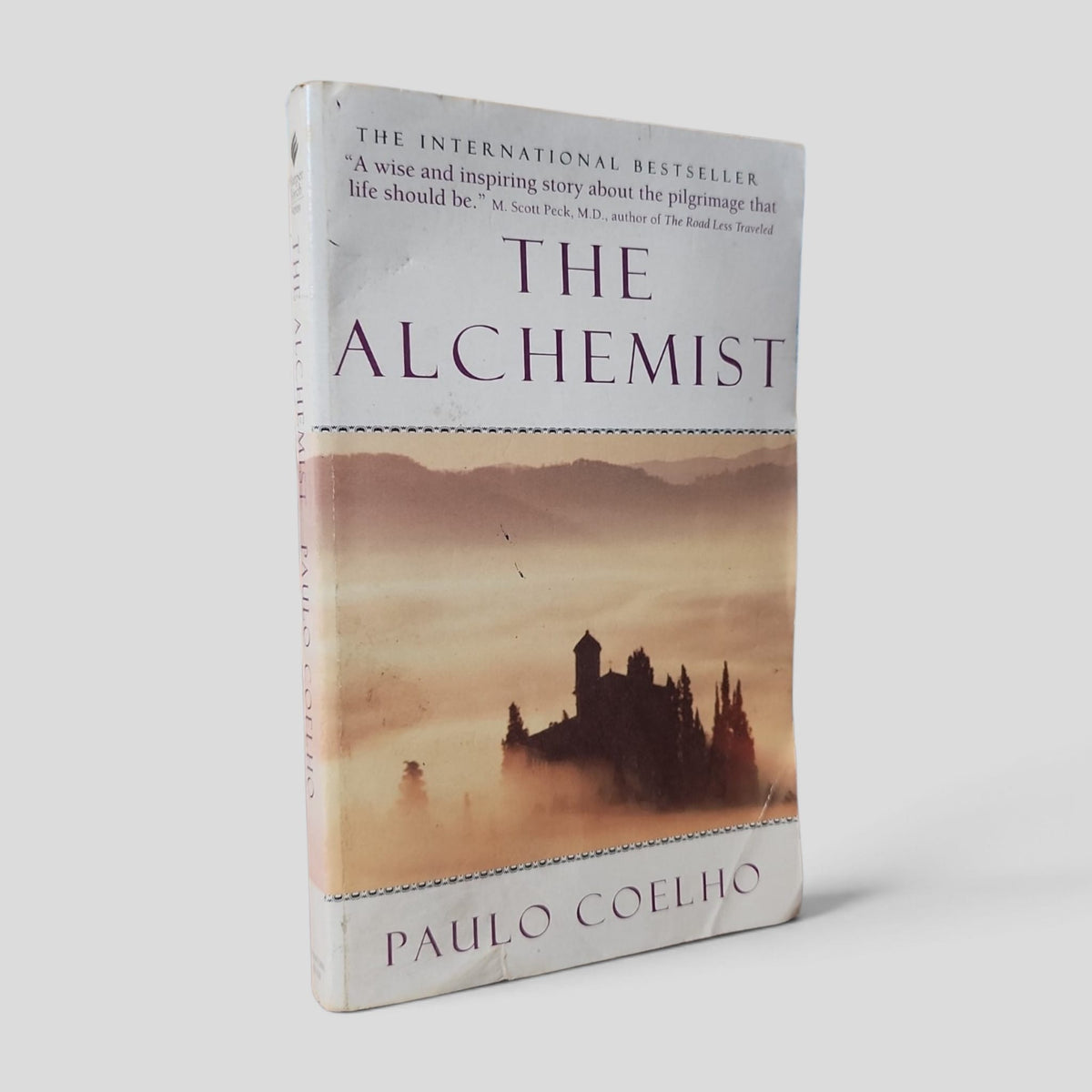 Front cover of The Alchemist by Paulo Coelho — actual used copy.