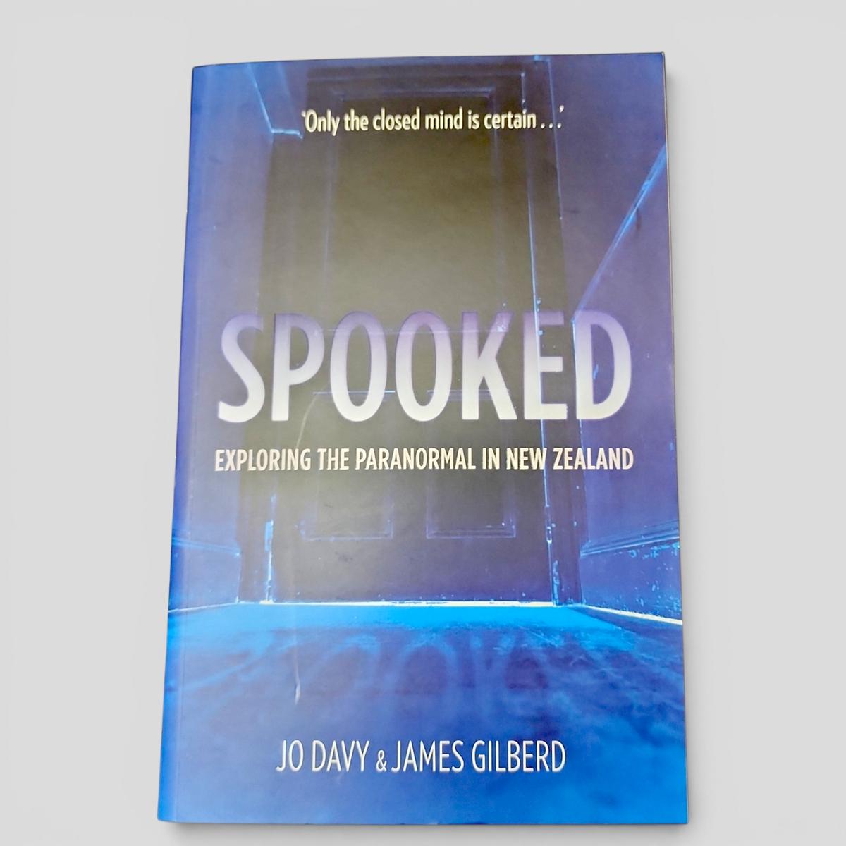 SPOOKED: Exploring the Paranormal in New Zealand by Jo Davy & James Gilberd - book cover