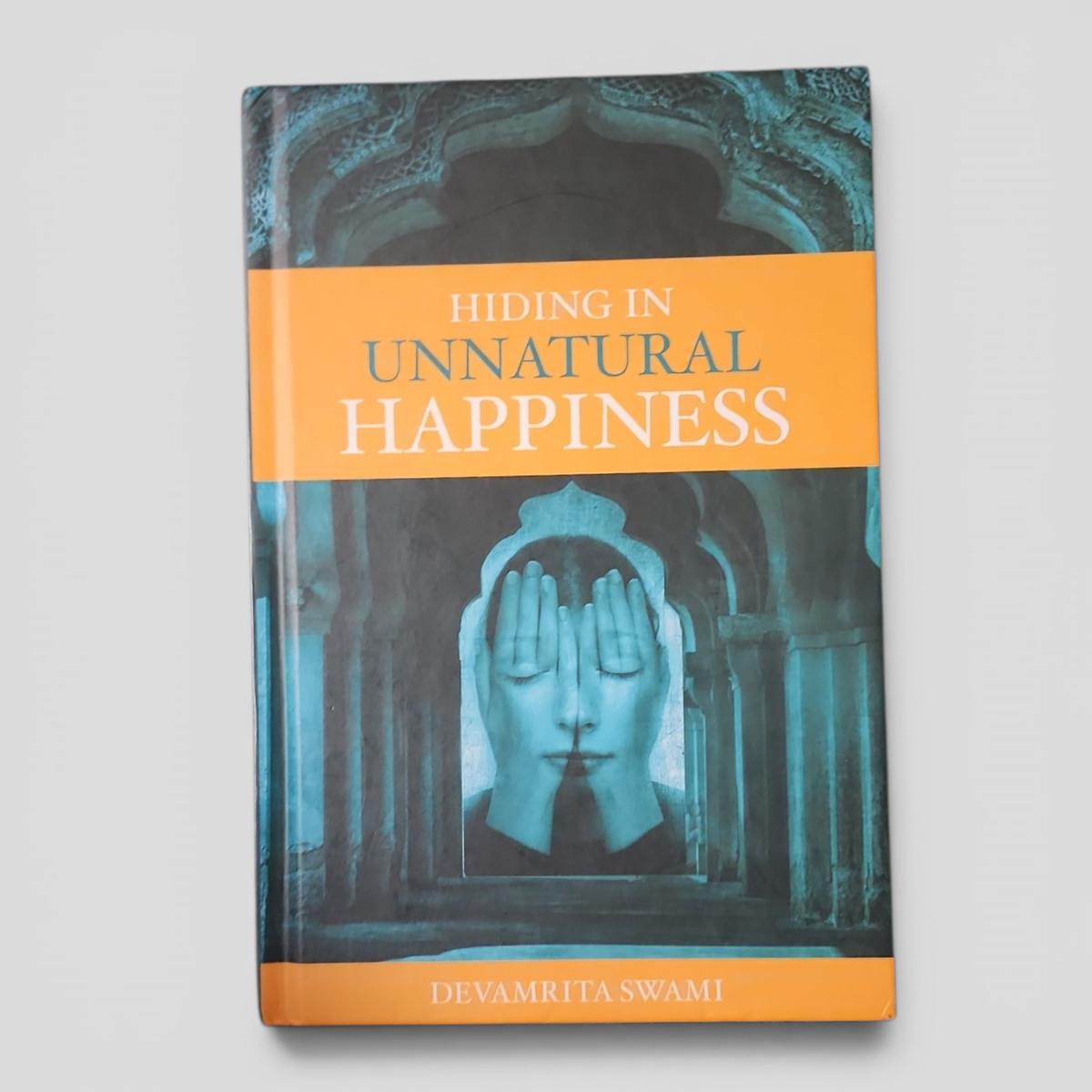 Hiding in Unnatural Happiness by Devamrita Swami - book cover
