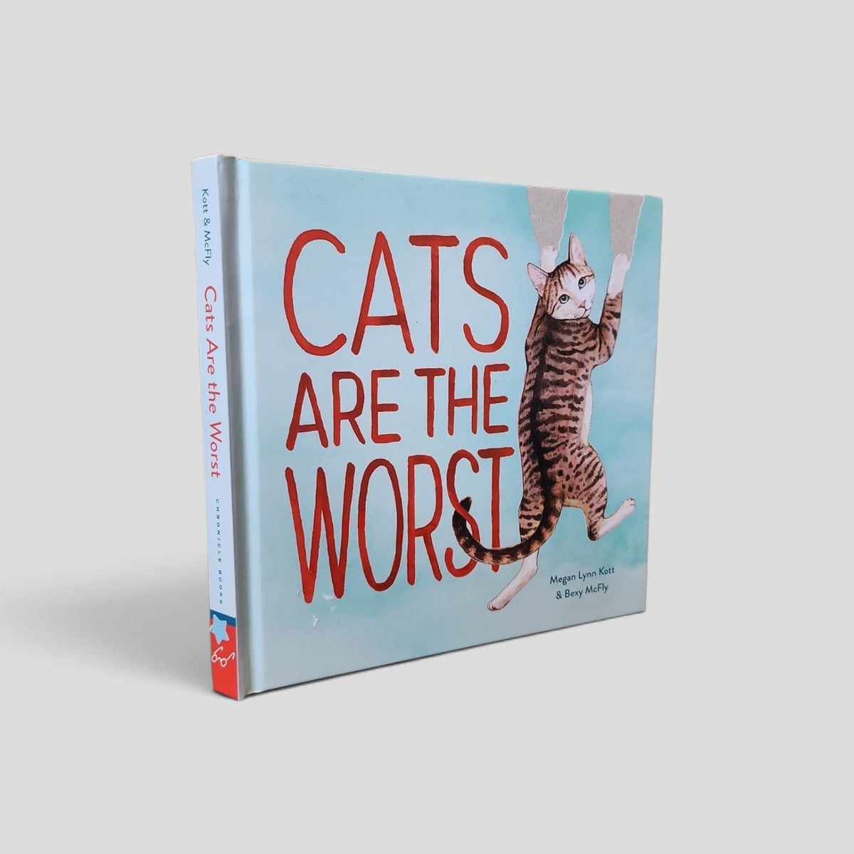 Cats Are the Worst by Bexy McFly and Megan Lynn Kott, blue illustrated front cover