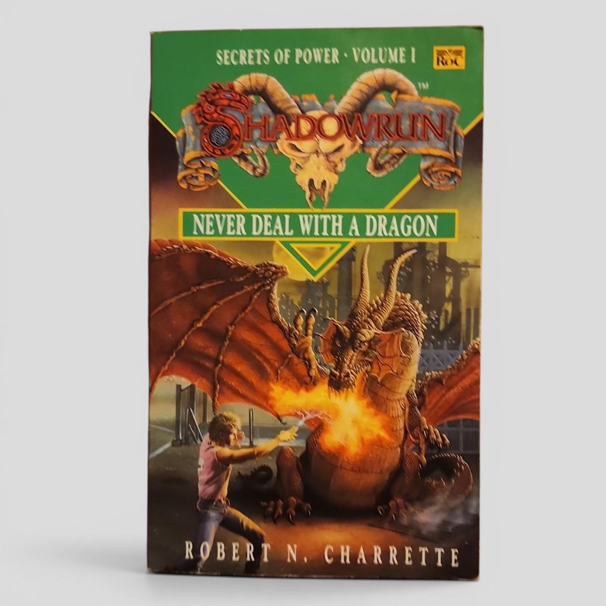 NEVER DEAL WITH A DRAGON (SECRETS OF POWER • VOLUME 1) by ROBERT N. CHARRETTE - book cover