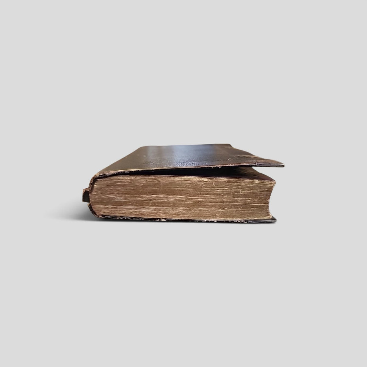 Antique English Version of the Polyglott Bible showing worn leather cover and gilt page edges