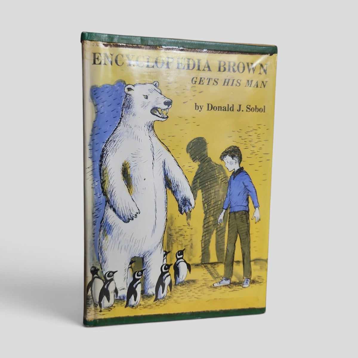 Front cover of Encyclopedia Brown Gets His Man by Donald J. Sobol