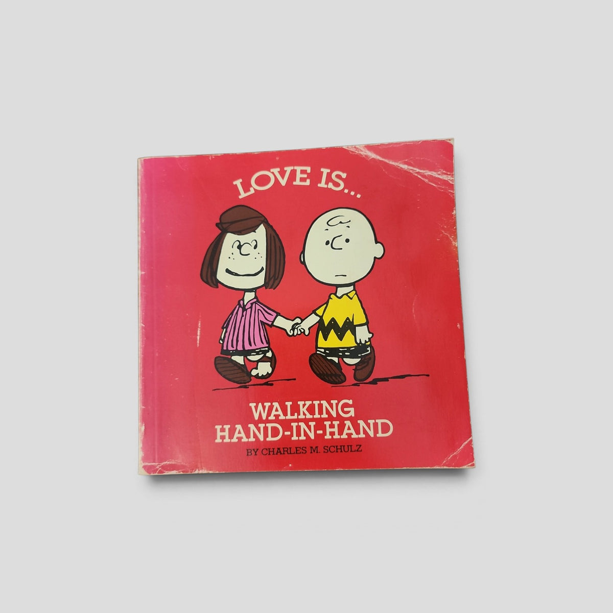 Love Is... Walking Hand-in-Hand by Charles M. Schulz