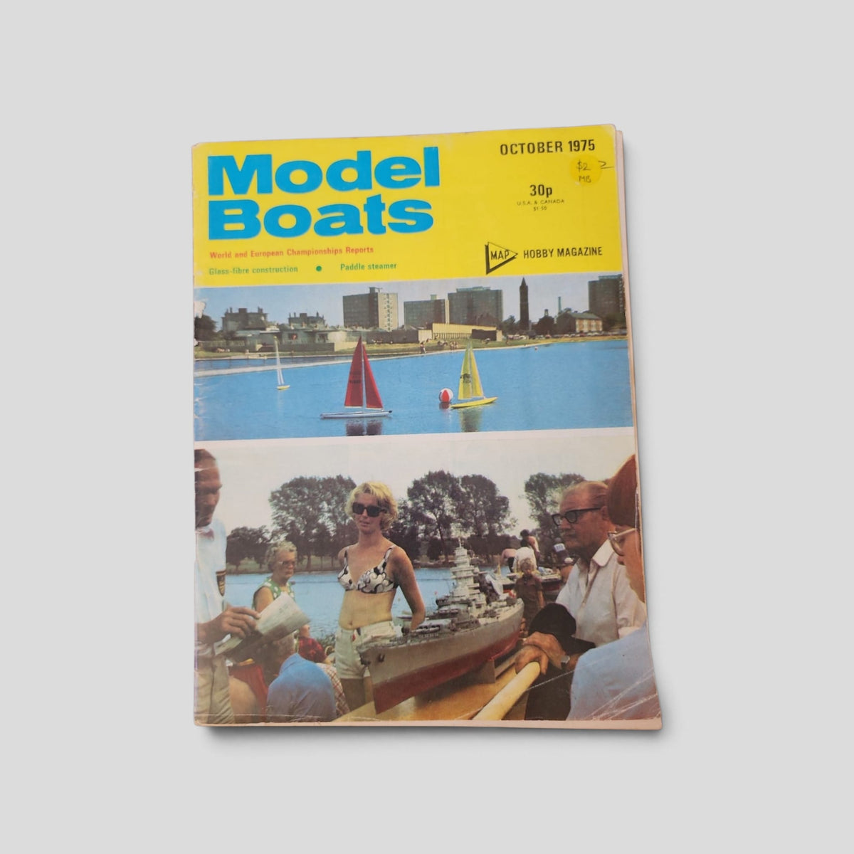 Front cover of Model Boats magazine, October 1975, with model sailing boats and a model ship display.
