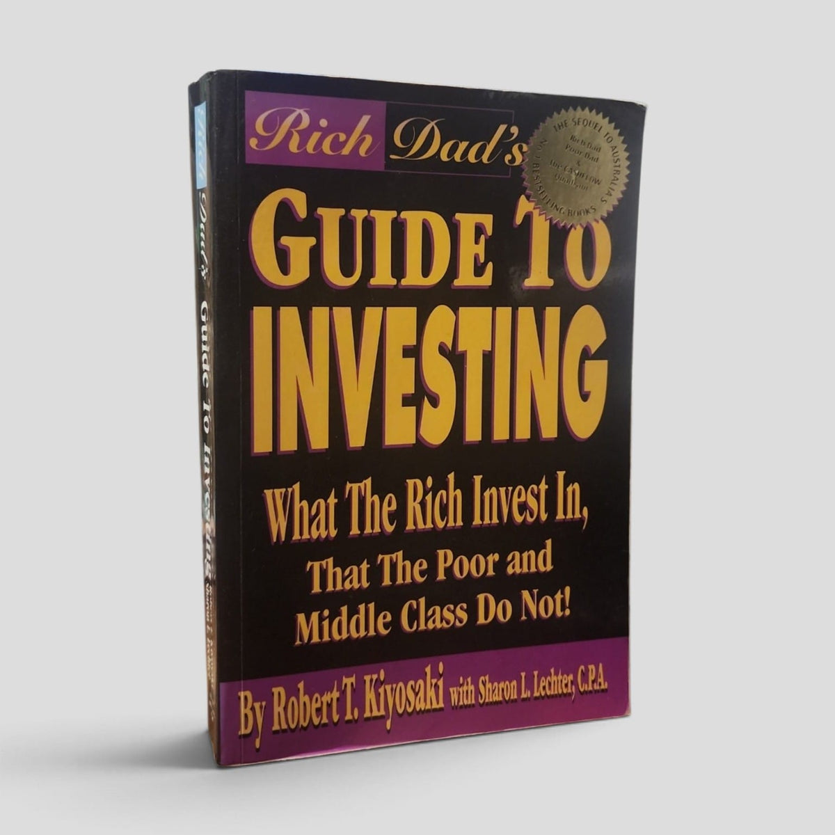 Rich Dad's Guide to Investing by Robert T. Kiyosaki and Sharon L. Lechter