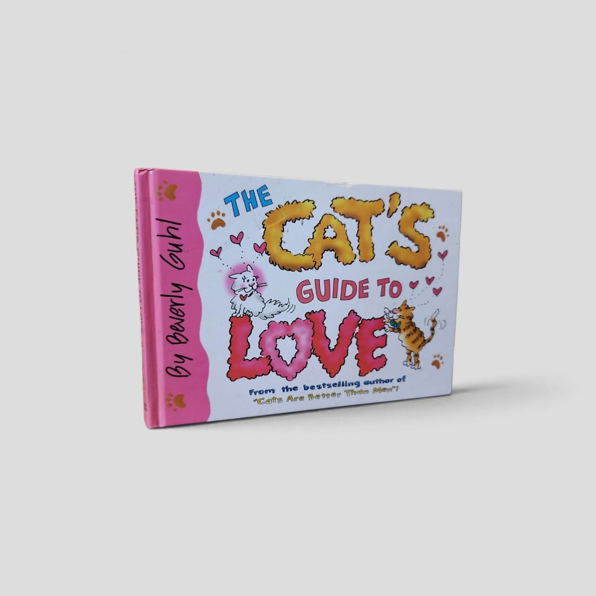 The Cat's Guide to Love by Beverly Guhl, pink illustrated front cover
